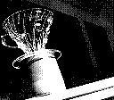 A clear hario v60 pour over sits upon a small mug in stark lighting and a harsh angle, taken in 2 bit black and white.