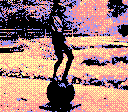 Statue of boy standing on ball